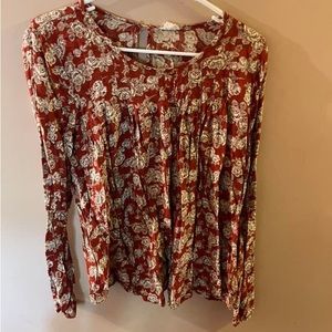 Burnt orange floral blouse